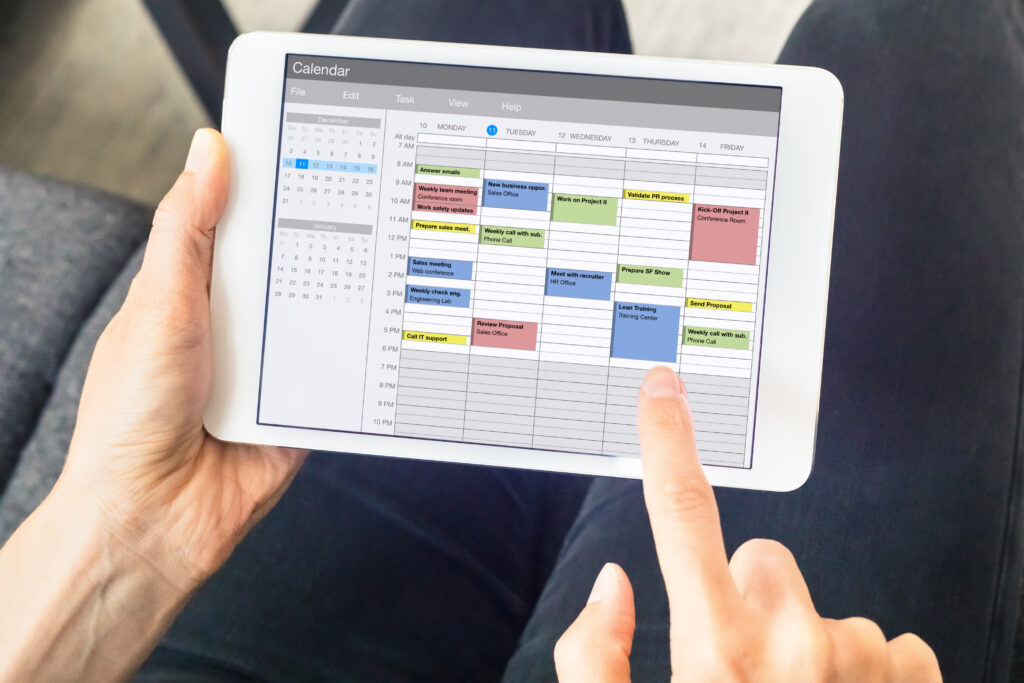Calendar app on tablet computer with planning of the week with appointments, events, tasks, and meeting