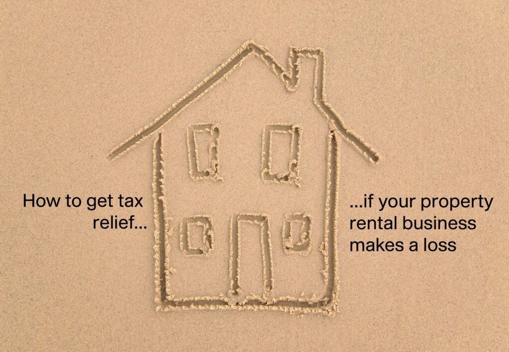 Child's picture of a house, drawn in sand, with words saying "How to get tax relief if your property rental business makes a loss"